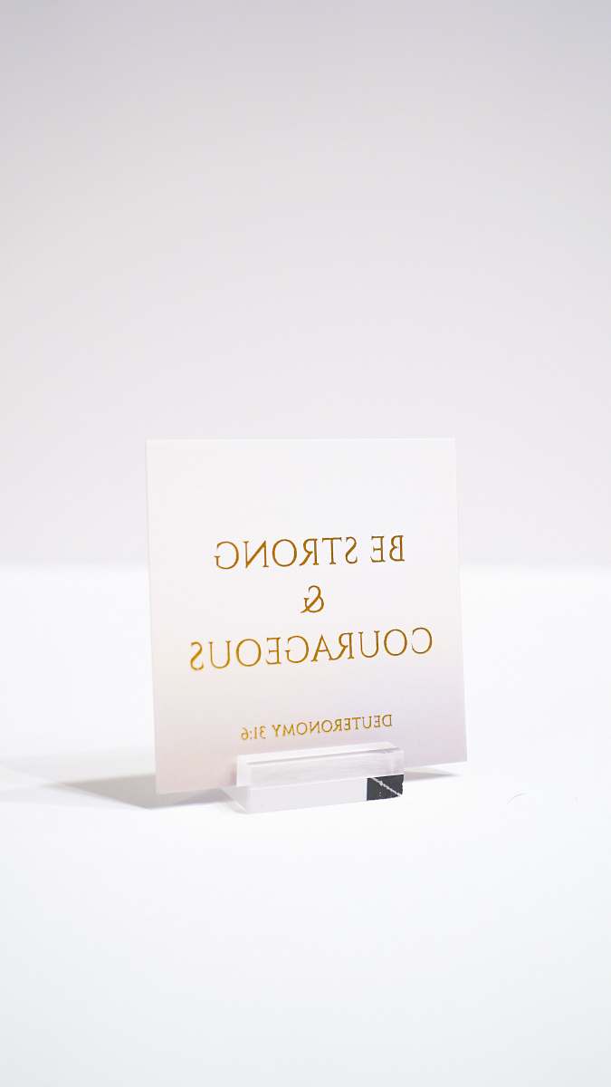 business card white paper with be strong and courageous printed text paper